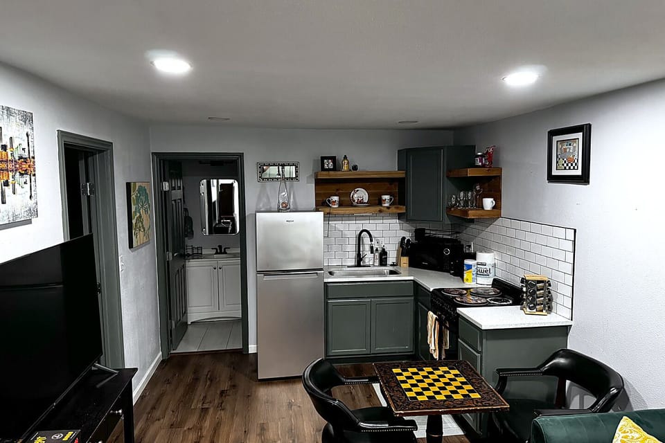 Modern kitchenette with stylish dining nook and sleek finishes