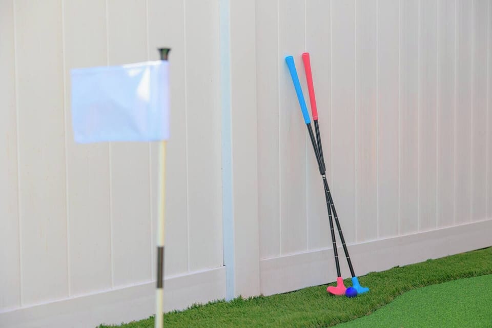 Backyard mini putt-putt paradise: Multiple holes, flags, and endless fun on low-maintenance turf