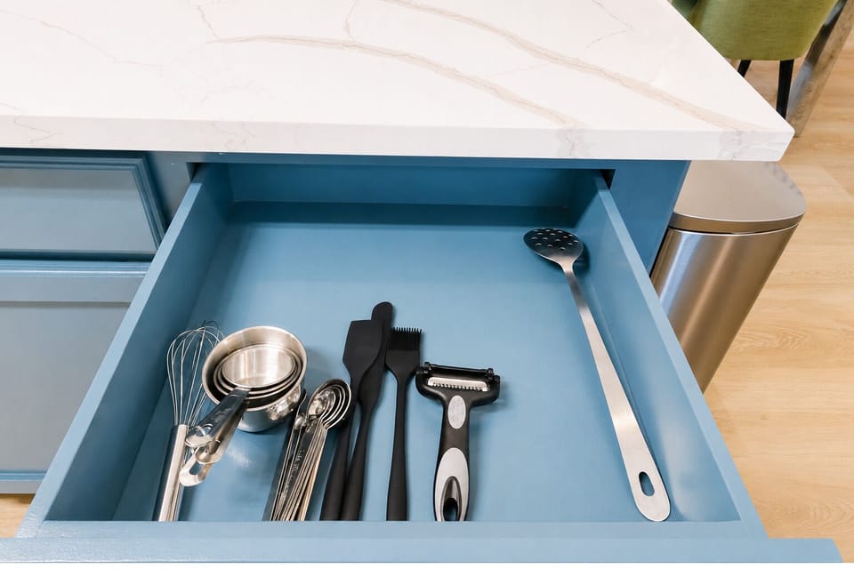 Well-stocked modern kitchen drawer with essential cooking tools