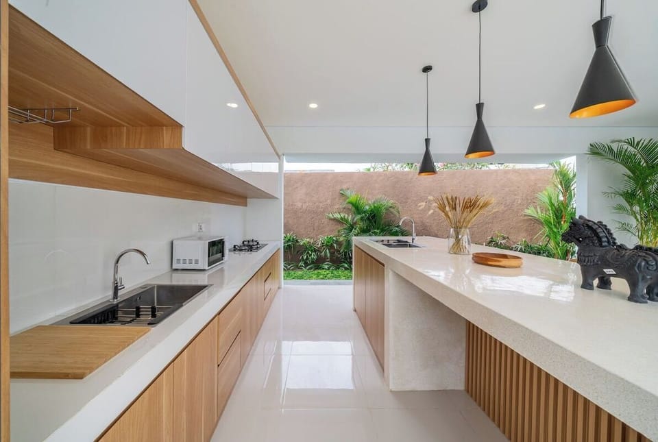 Kitchen: Experience culinary bliss in a bright, modern space with stunning garden views!
