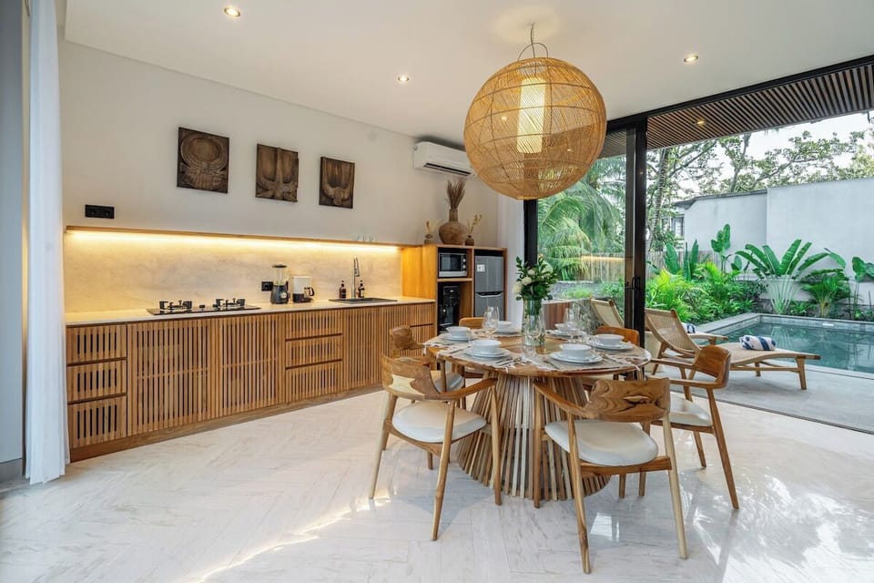 Dining Area: Savor meals amidst lush views and bamboo decor—your tropical retreat awaits!