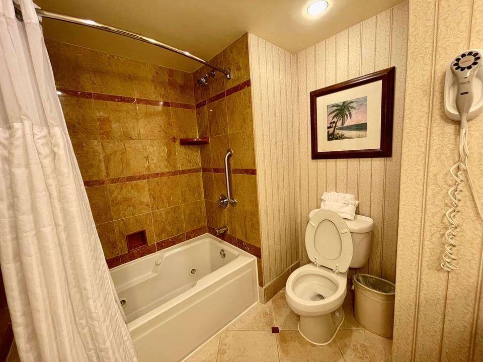 Freshen up easily with a clean bath and shower combo.