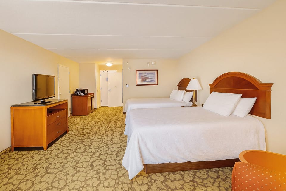Recharge in plush beds with a roomy, calm atmosphere.