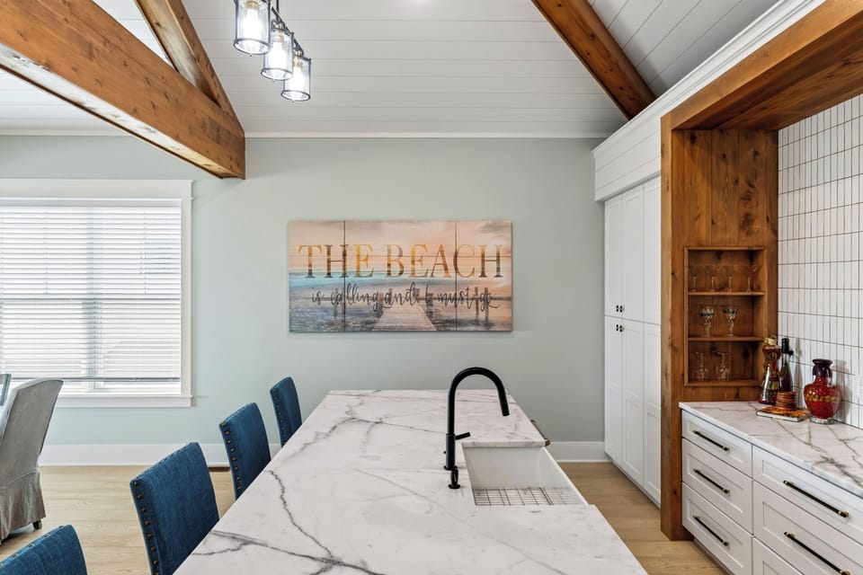 A spacious wet bar with island seating for four, a full-size refrigerator, and coffee station makes entertaining easy.