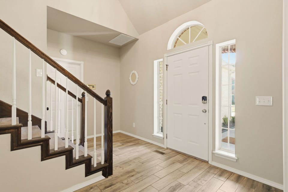 Spacious entryway offers plenty of space for shoes and bags.