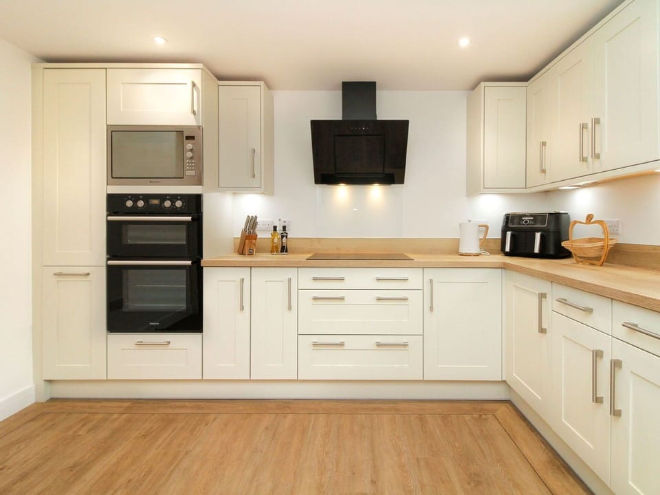 Wood, Kitchen, Flooring, Countertop, Cabinetry, Interior Design, Furniture, Major Appliance, Kitchen Appliance, Cupboard
