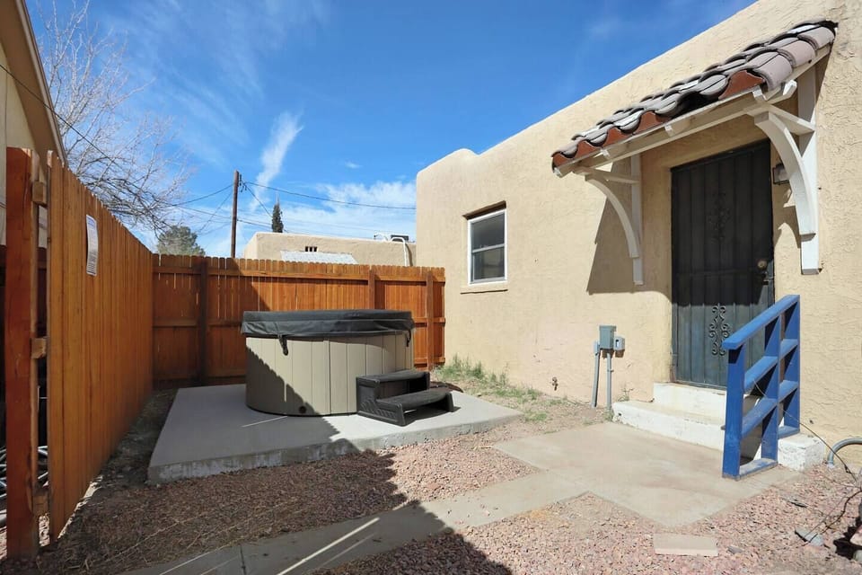 Relax in your own private oasis! This fenced patio features a hot tub—perfect for unwinding under the open sky after a day of exploring.