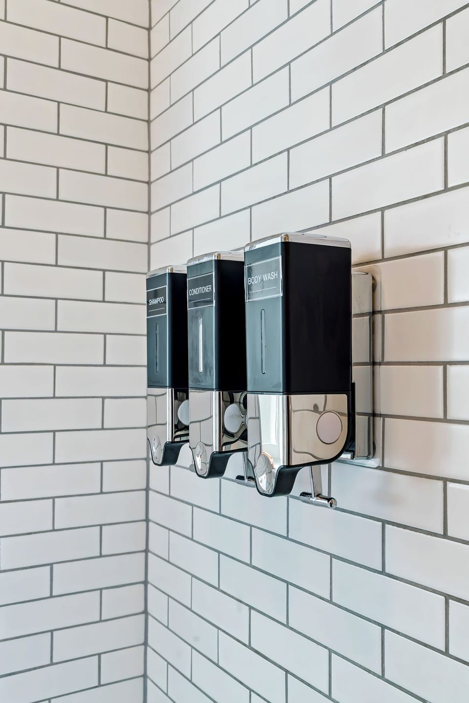 Modern tiled shower with shampoo, conditioner & body wash dispensers