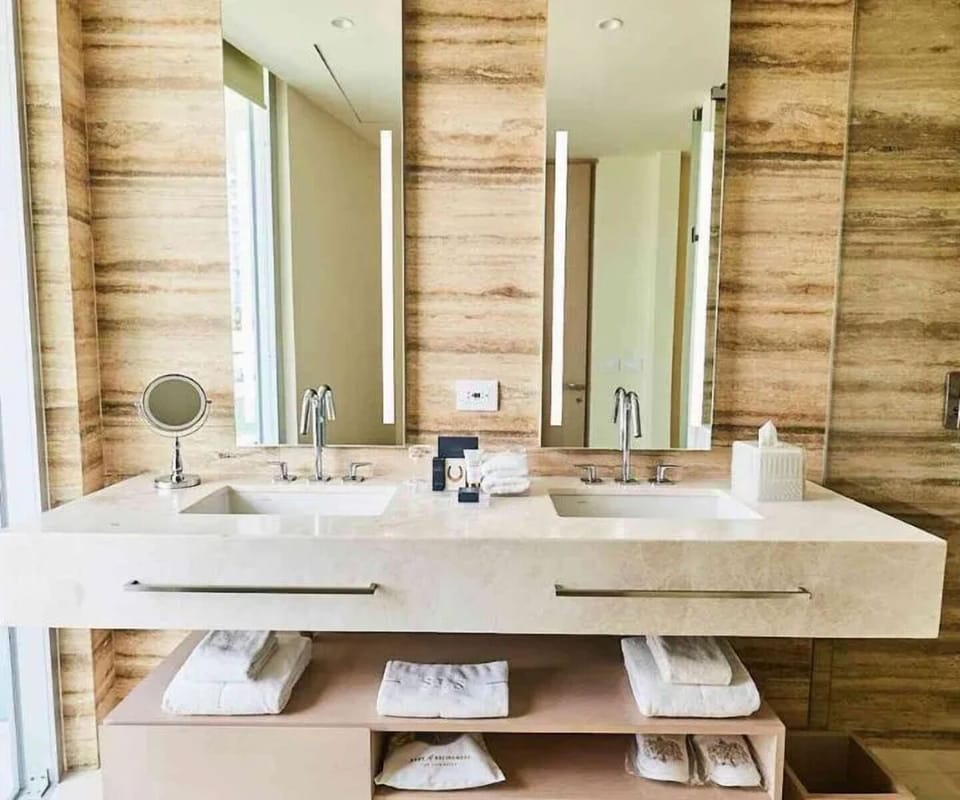 Get ready easily at the bright double-vanity setup.