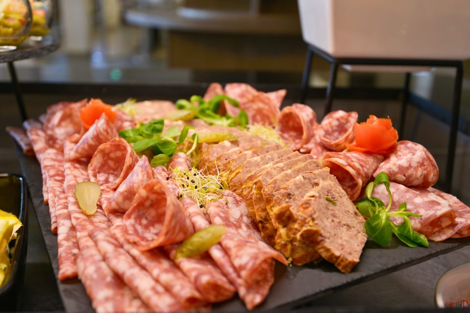 Charcuterie platter with assorted meats.