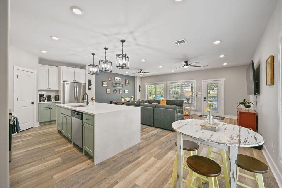 Open-concept kitchen flows directly into the living and dining areas.