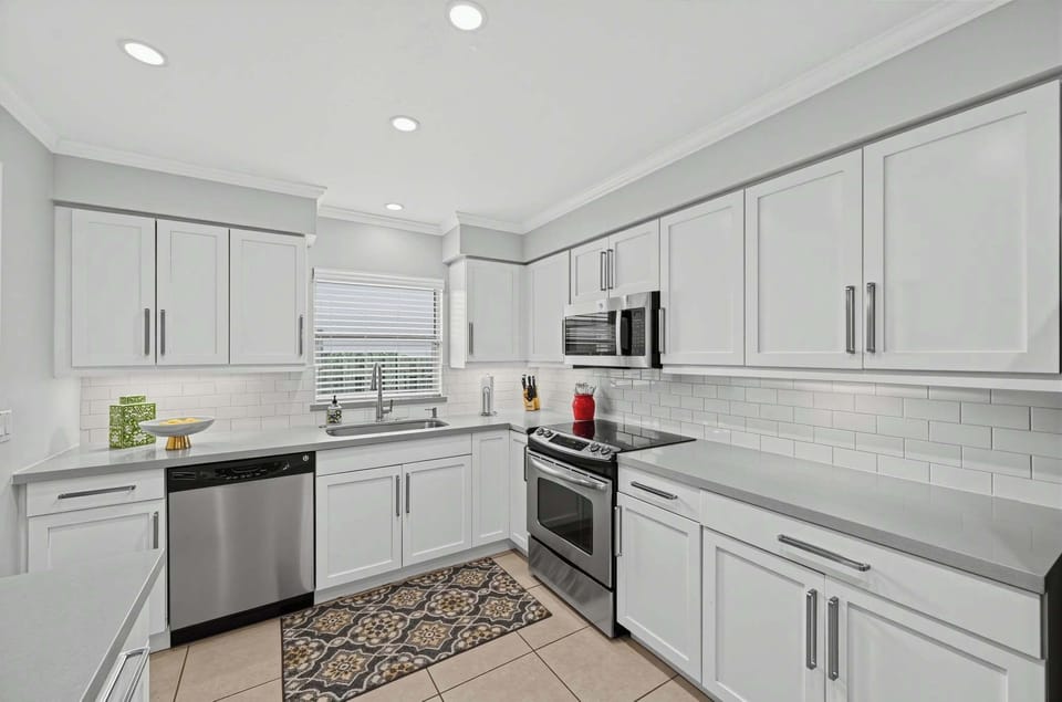 Bright kitchen with modern appliances, ample storage, and plenty of workspace.