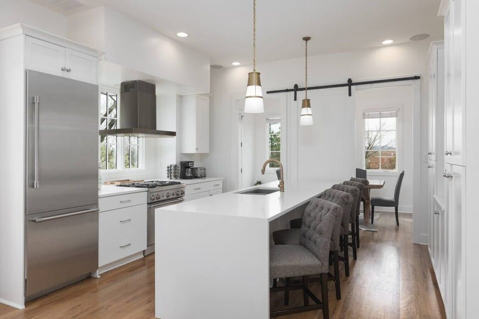 Fully equipped kitchen with stainless steel appliances, seating for 5 at the kitchen island, additional seating at the dining room table and all the dishware / utensils you might need.