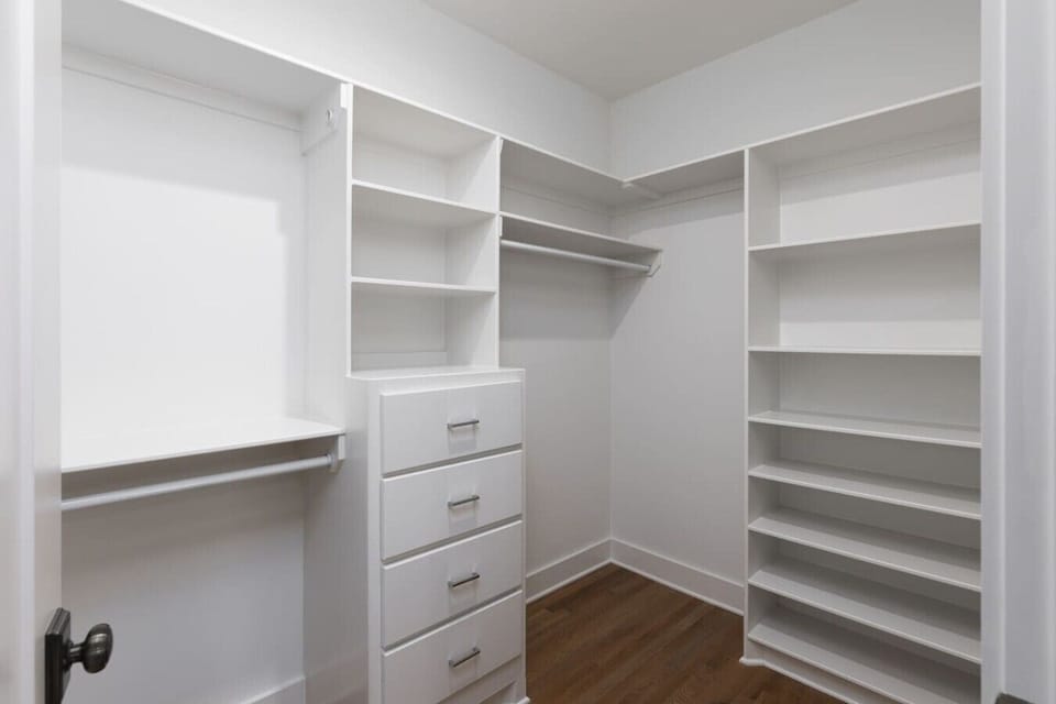 Primary bedroom on the 2nd floor with a king bed, Smart TV, ensuite bath, and room darkening shades.  Includes a large walk-in closet. Tastefully decorated with high-end modern furnishings.