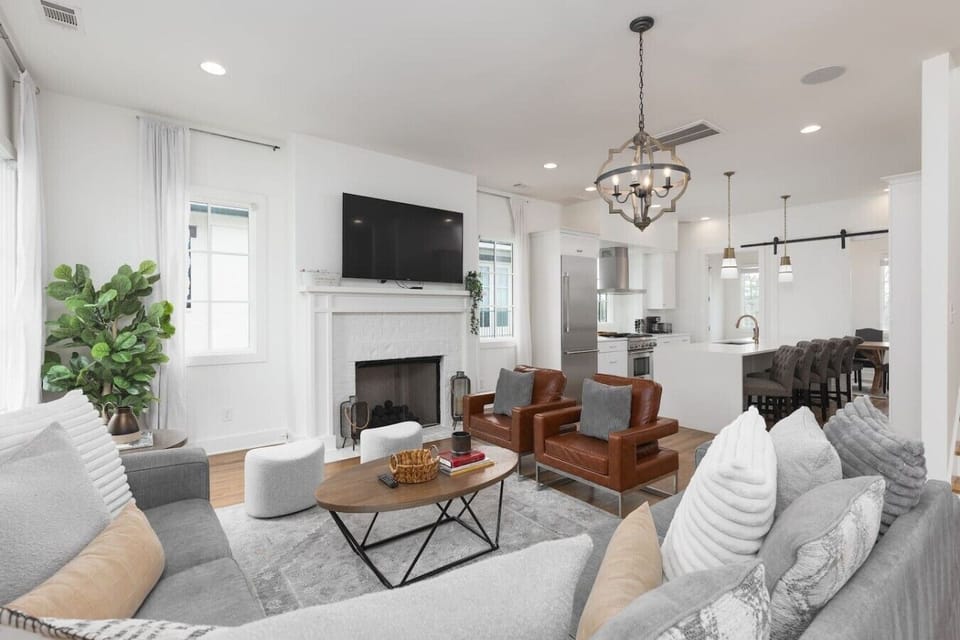 Cozy living room with comfortable seating, a fireplace and a Smart TV.