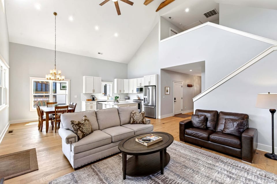 Living room with gas fireplace, Smart TV for streaming, and deck access.