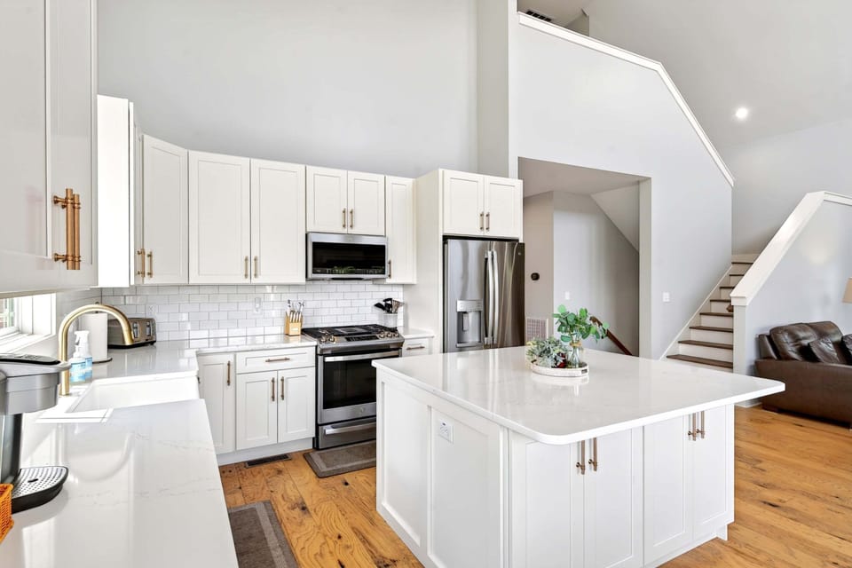 Well-equipped kitchen with stainless appliances, dishwasher, and Keurig coffee maker.
