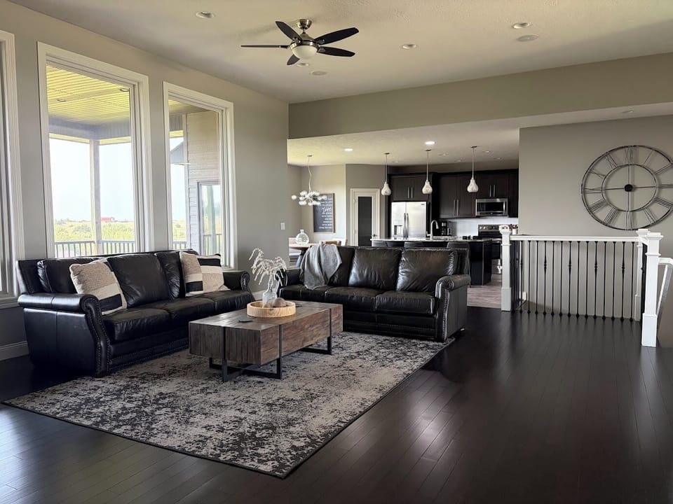 Bright open-concept living room with scenic views and stylish modern kitchen