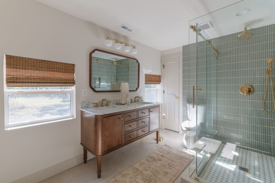 Double sink vanity with walk in shower.