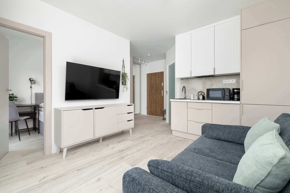 The living room has a modern look and comfortable furniture.