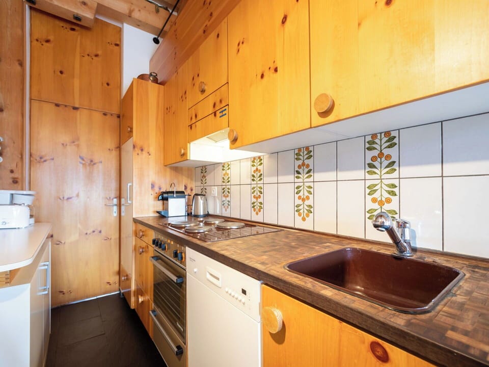 Wood, Kitchen, Flooring, Countertop, Floor, Interior Design, Sink, Major Appliance, Cabinetry, Tap