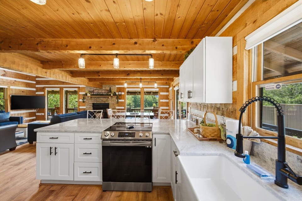 Step into your spacious retreat where rustic warmth meets modern comfort. Cook, relax, and gather in this open-concept cabin designed for effortless mountain living.