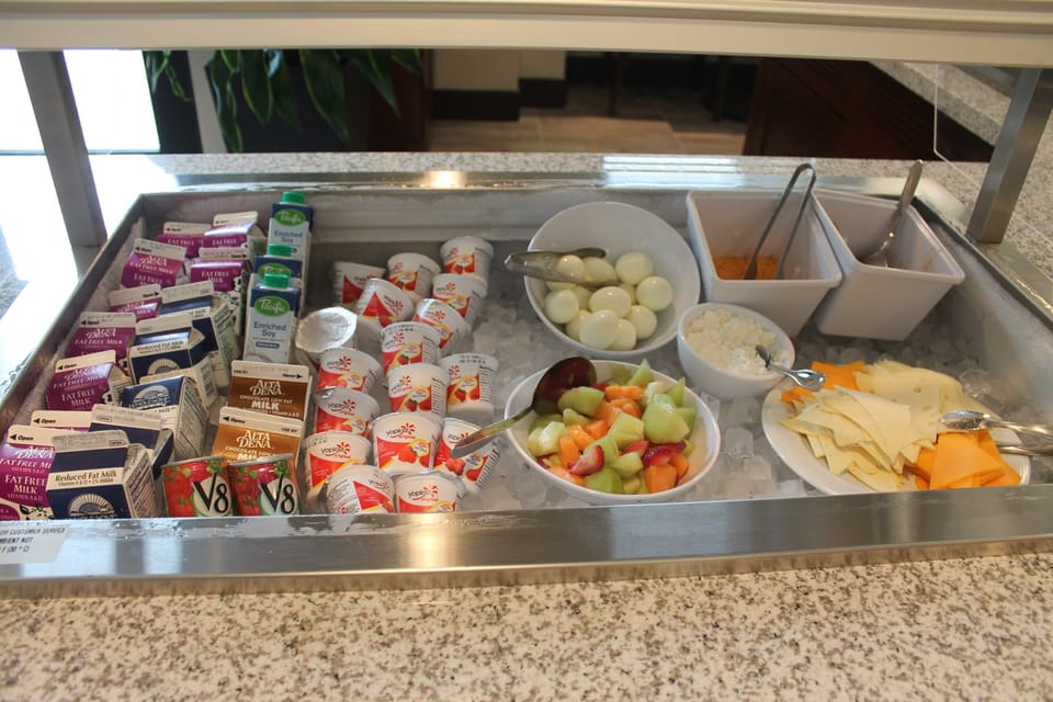 Breakfast station with variety of hot and cold items.