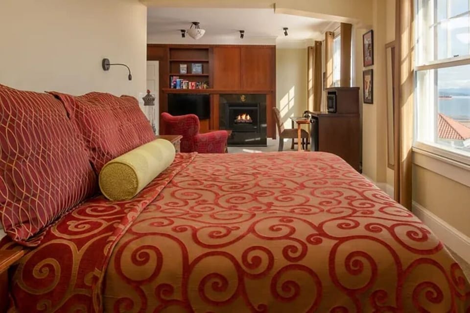 Sink into patterned linens while the fireplace glows nearby.