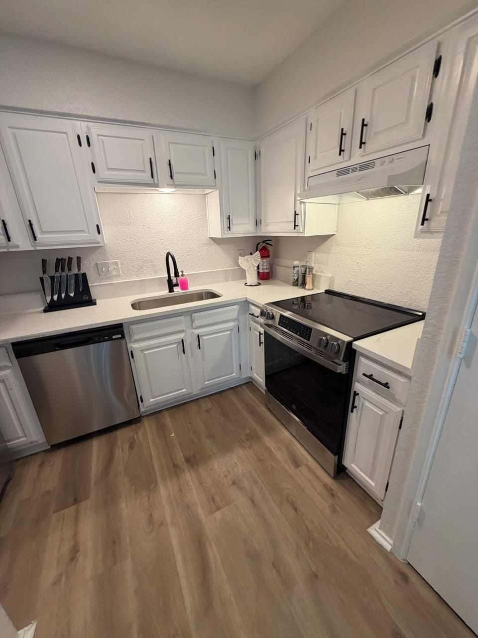 Bright updated kitchen with stainless appliances and ample storage