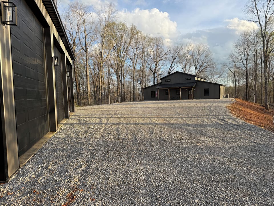 Driveway has ample parking for cars and trailers.