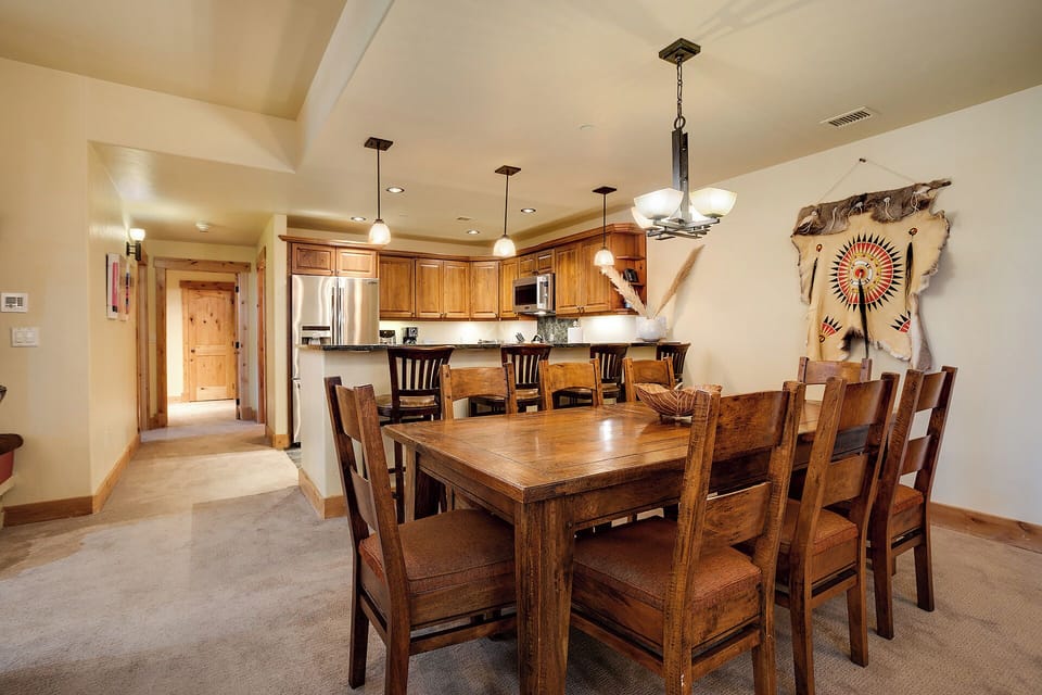 Gather around this handsome wooden table where you'll share stories over home-cooked meals. The fully equipped kitchen and warm Southwestern touches create the perfect backdrop for your mountain getaway.