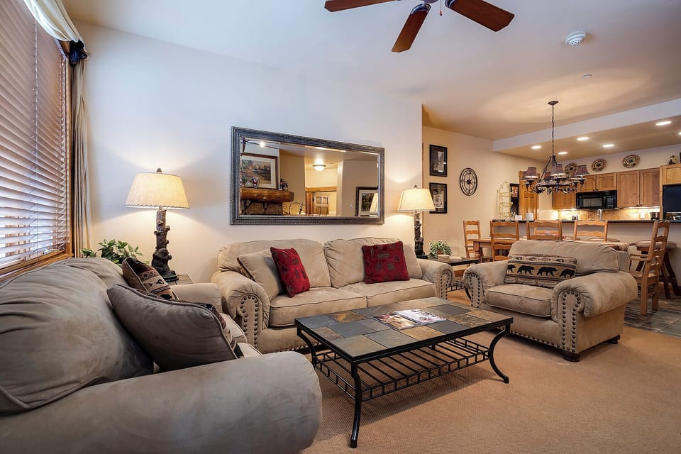 Sink into plush seating and unwind in your inviting living space, where warm lighting and thoughtful touches create the perfect atmosphere for relaxing evenings together.
