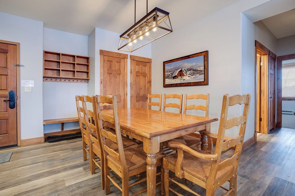 Gather around this handsome wooden dining table where memorable meals and laughter await. The rustic charm and spacious seating invite you to unwind and enjoy quality time together.