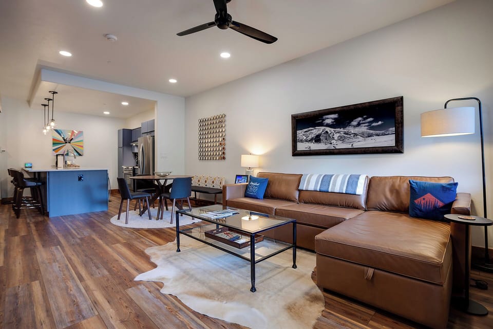 Sink into plush leather and unwind in your bright, open living space, where modern mountain style meets cozy warmth. Gather here to share stories and make memories together.