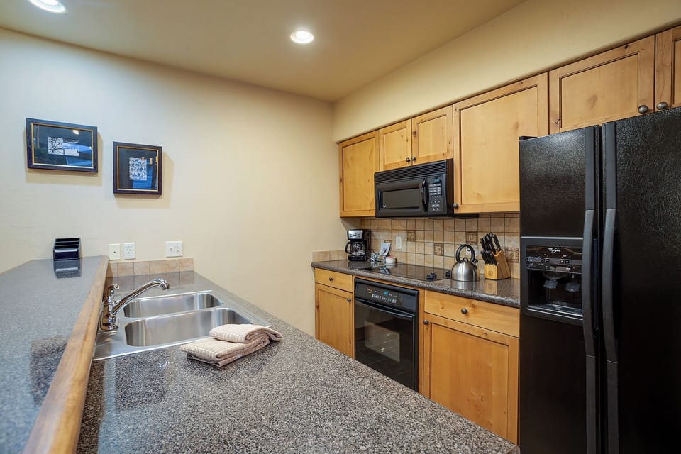 Your fully equipped kitchen features modern appliances and granite countertops, giving you everything you need to prepare delicious meals during your stay.