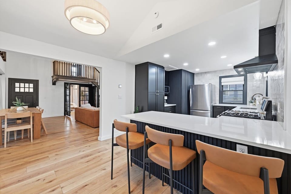 Beautiful, chic kitchen features eat-in space for 3 and fully stocked 