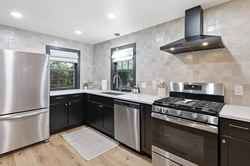Cook at home in the fully equipped kitchen featuring stainless steel appliances, plenty of prep space and everything you need for an easy group getaway