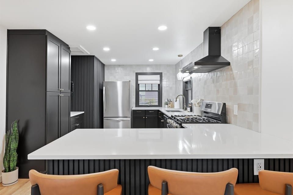 Kitchen features gas range, microwave, dishwasher, full fridge with ice maker, fully stocked cabinets and even includes crock pot, air fryer, coffee maker, toaster, ninja blender, waffle maker and more