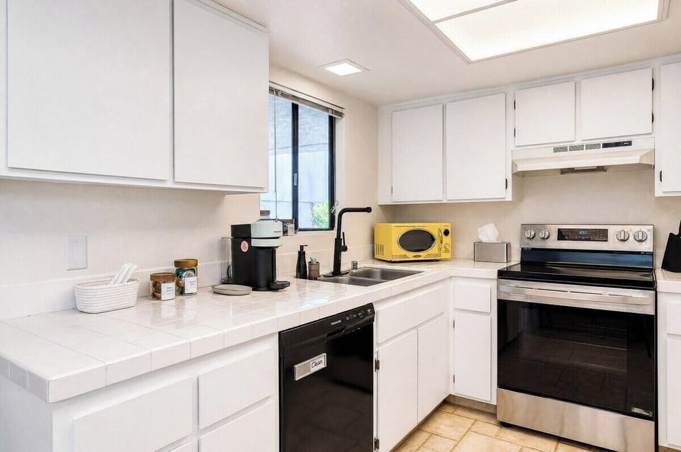 Step into your fully equipped kitchen with modern appliances, bright skylights, and plenty of counter space—perfect for whipping up meals during your stay.