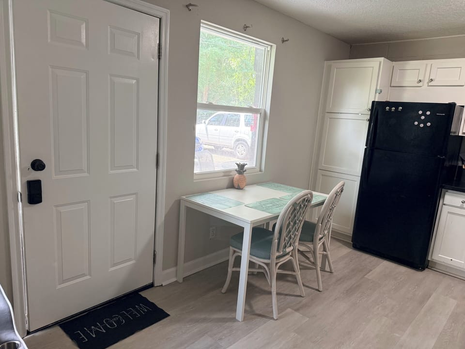 Bright kitchen nook with sunny window seating for two