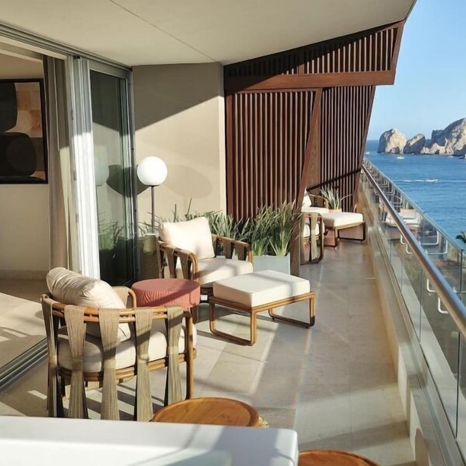 Spacious oceanview balcony with chic lounge seating and coastal views