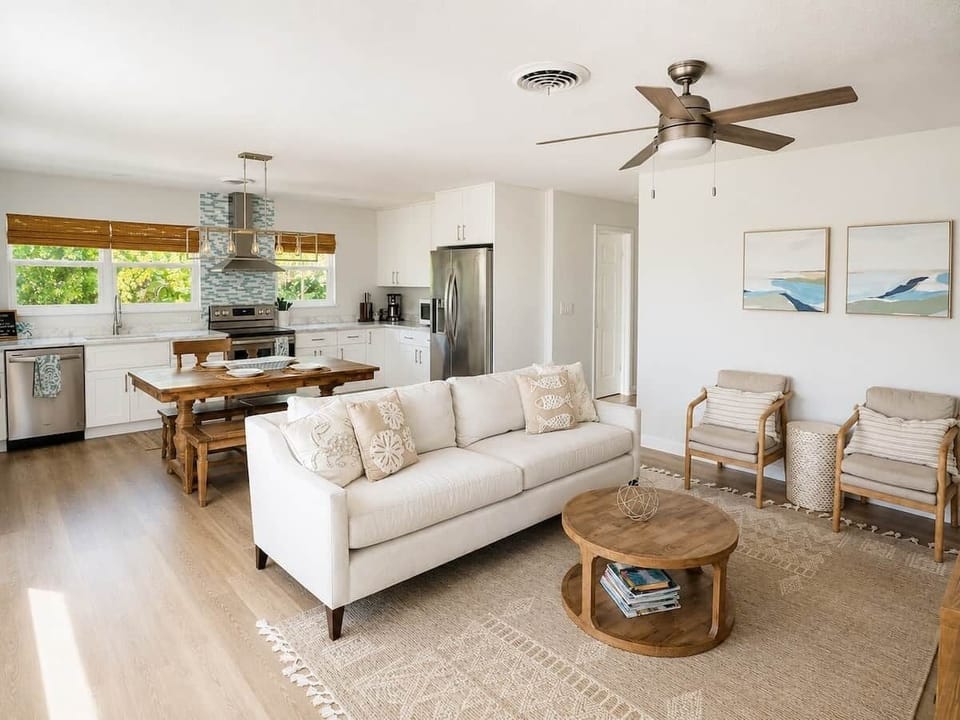 Modern and open floorplan creates an inviting space for guests to relax and enjoy the tropical view.