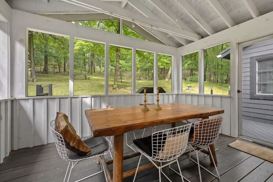 Sunroom directly connected to the kitchen and steps from the grill.