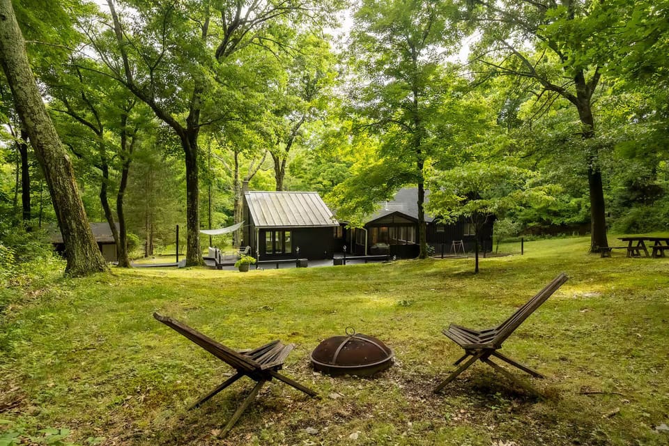 4 private acres extending from the back of the house to the fire pit and beyond.
