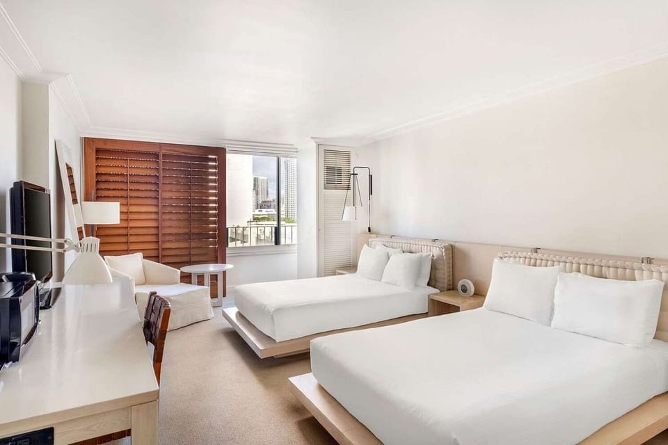 Studio Suite • Two Double Beds, Sitting Area & City View