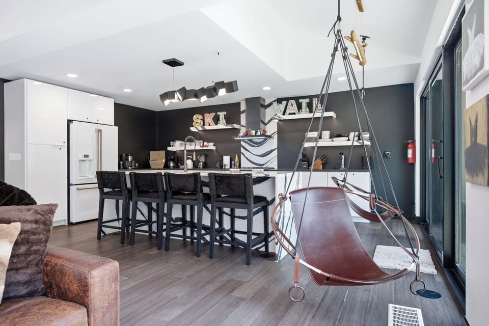 Beauitufl updated kitchen with island seating, amazing views from every inch of this home and a swing to take in those views