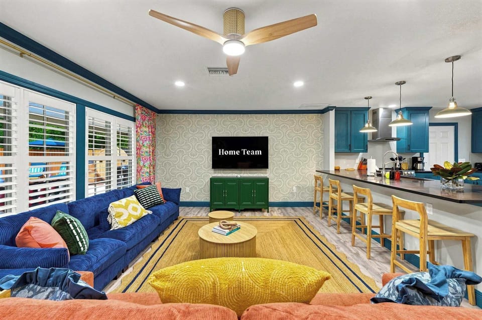 Movie night, game day, or just background noise while you cook — this open living space keeps the group together no matter what everyone's doing.