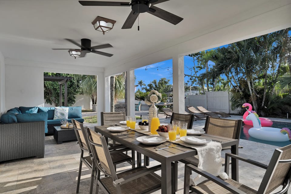 Breakfast is served lanai-side with the pool sparkling just beyond — the perfect setting for slow mornings in the Florida sun