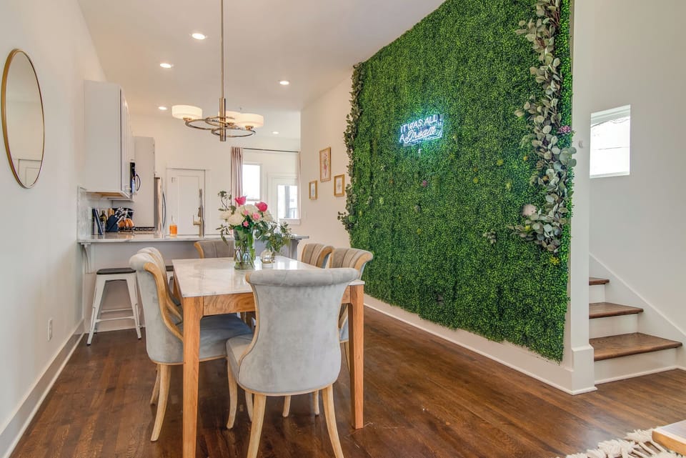 Our dining room's lush greenery wall steals the spotlight as our favorite feature!