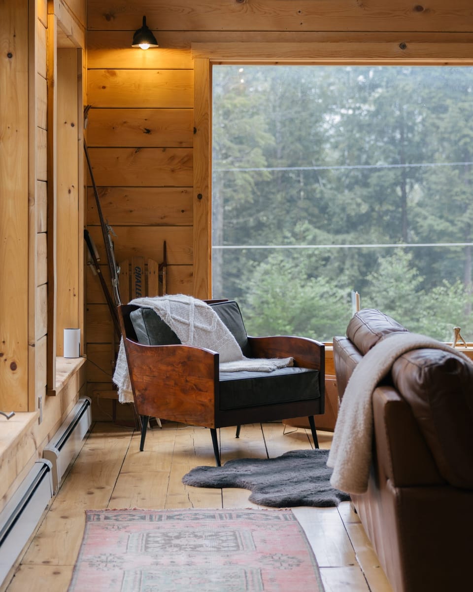 Watch the forest sway through floor-to-ceiling windows while curled up in this quiet reading corner.